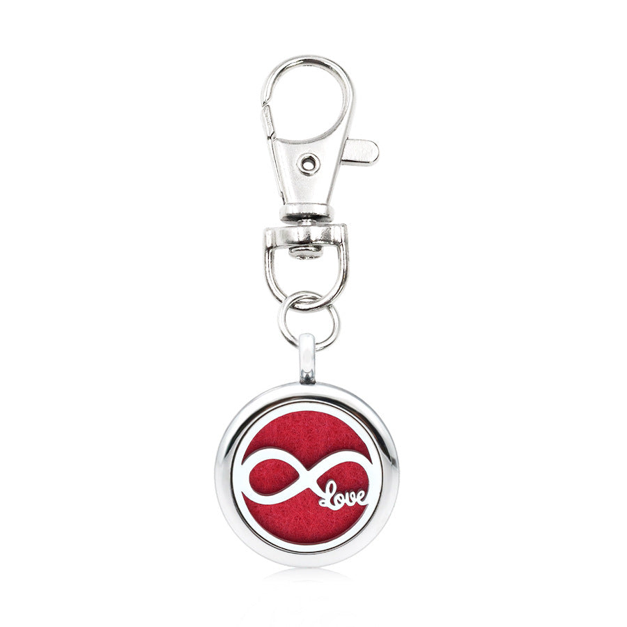 Wholesale Alloy Angel Wings Hollow Aromatherapy Essential Oil Keychain